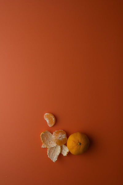 Foodfotografie auf orangem Hintergrund: Zitrusfrüchte auf Backdrop „Mandarine" 